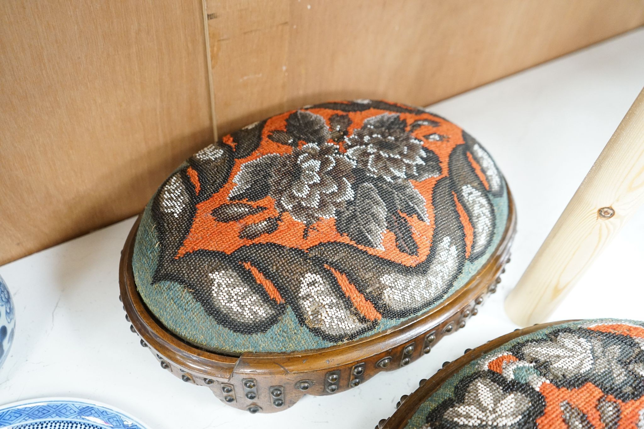 A pair of Berlin beadwork footstools, 38cm